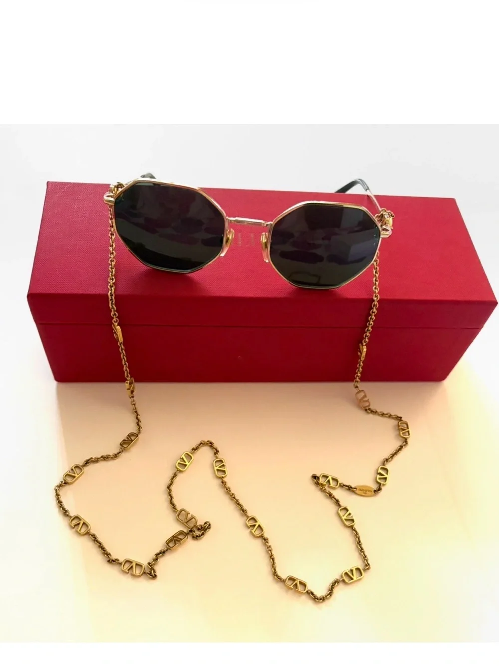 Valentino Garavani Octagonal Metal Sunglasses with a gold Vlogo chain